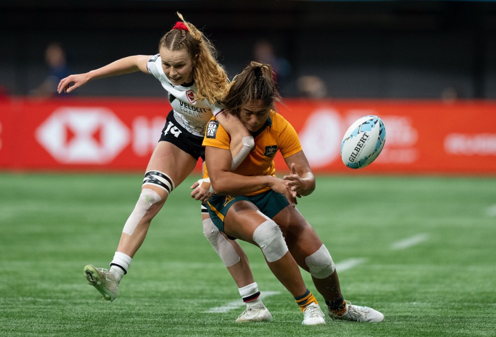 Canada's Carissa Norsten, left, and Australia's Sariah Paki (65) during Vancouver Sevens women's rugby action, in Vancouver, on Saturday, March 7, 2026. THE CANADIAN PRESS/Ethan Cairns