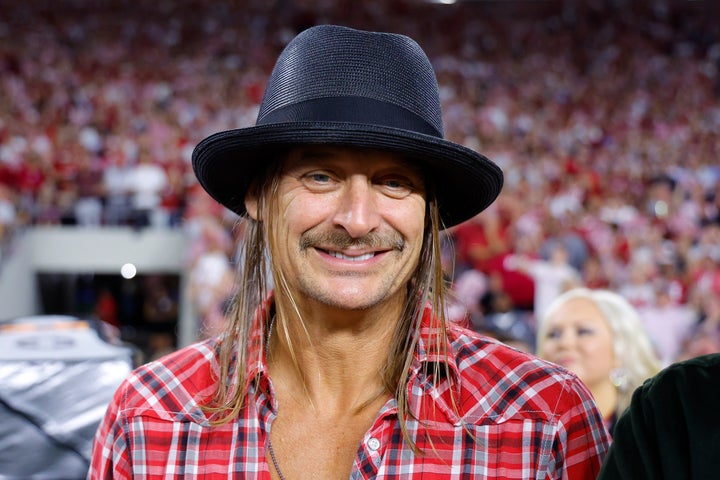 Kid Rock smiles on the sideline during a 2024 game between the Georgia Bulldogs and the Alabama Crimson Tide at Bryant-Denny Stadium in Tuscaloosa, Ala.