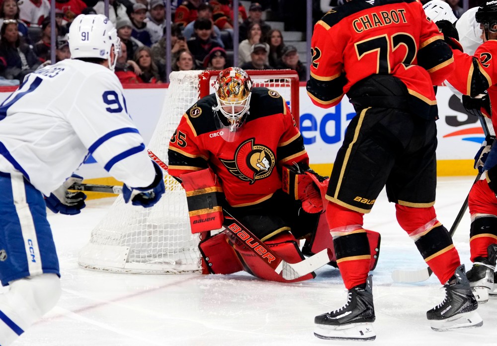 Ottawa Senators goaltender Linus Ullmark (35) makes a blocker save on Toronto Maple Leafs' John Tavares (91) during first period NHL hockey action in Ottawa, on Saturday, March 21, 2026. THE CANADIAN PRESS/Justin Tang