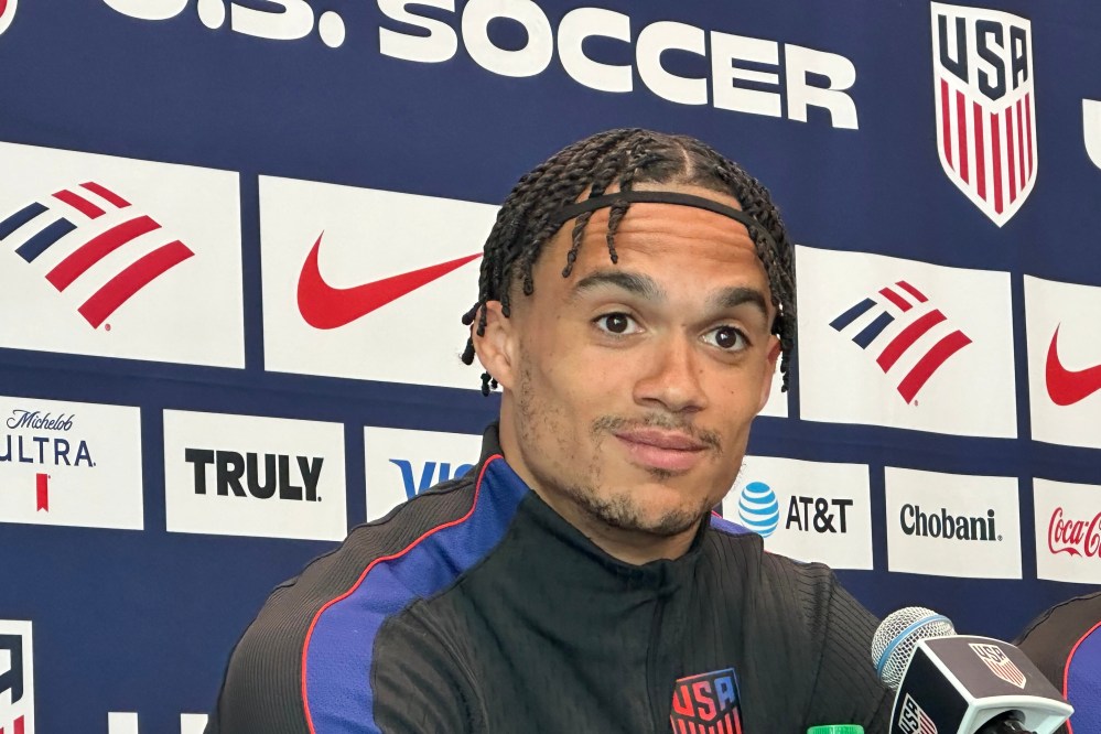Unites States' Antonee Robinson listens during a news conference before the men's national soccer team training, Friday, March 27, 2026, in Marietta, Ga. (AP Photo/Ronald Blum
