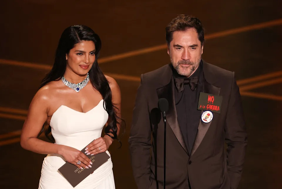 Indian actress Priyanka Chopra and Spanish actor Javier Bardem present the award for Best International Feature Film onstage during the 98th Annual Academy Awards at the Dolby Theatre in Hollywood, California on March 15, 2026. (Photo by Patrick T. Fallon / AFP via Getty Images)