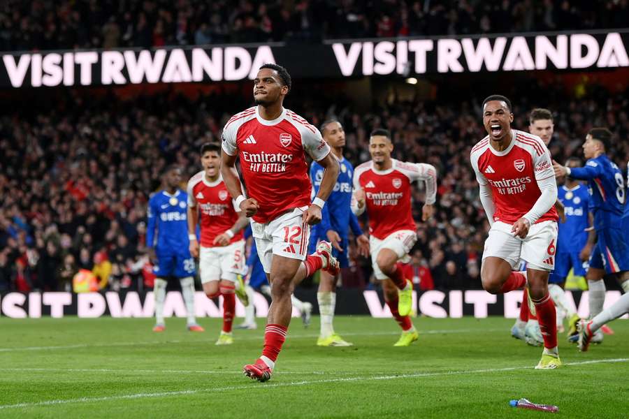 Arsenal's Jurrien Timber celebrates scoring their second goal with Gabriel Magalhaes