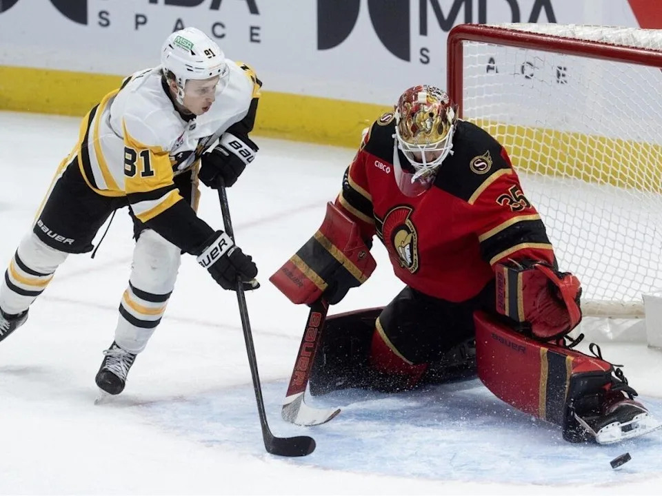 Ottawa Senators’ Linus Ullmark (35) makes a save as Pittsburgh Penguins’ Ben Kindl (81) seeks the rebound in the first period of a National Hockey League game at Ottawa on March 26, 2026.