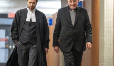 Quebec Cardinal Marc Ouellet, right, walks with one of his lawyers during a break at the courthouse in Montreal on Thursday, March 5, 2026. THE CANADIAN PRESS/Christinne Muschi