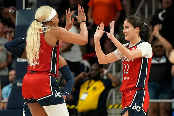 WASHINGTON, DC - JUNE 22: Sonia Citron #22 of the Washington Mystics celebrates with Kiki Iriafen #44 after scoring the game-winning three-point shot in overtime against the Dallas Wings at Carefirst Arena on June 22, 2025 in Washington, DC. NOTE TO USER: User expressly acknowledges and agrees that, by downloading and or using this photograph, User is consenting to the terms and conditions of the Getty Images License Agreement. (Photo by Jess Rapfogel/Getty Images)
