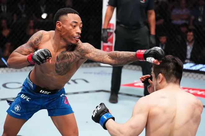 LAS VEGAS, NEVADA - MARCH 14: (L-R) Elijah Smith punches SuYoung You of South Korea in a bantamweight fight during the UFC Fight Night event at Meta APEX on March 14, 2026 in Las Vegas, Nevada. (Photo by Chris Unger/Zuffa LLC)
