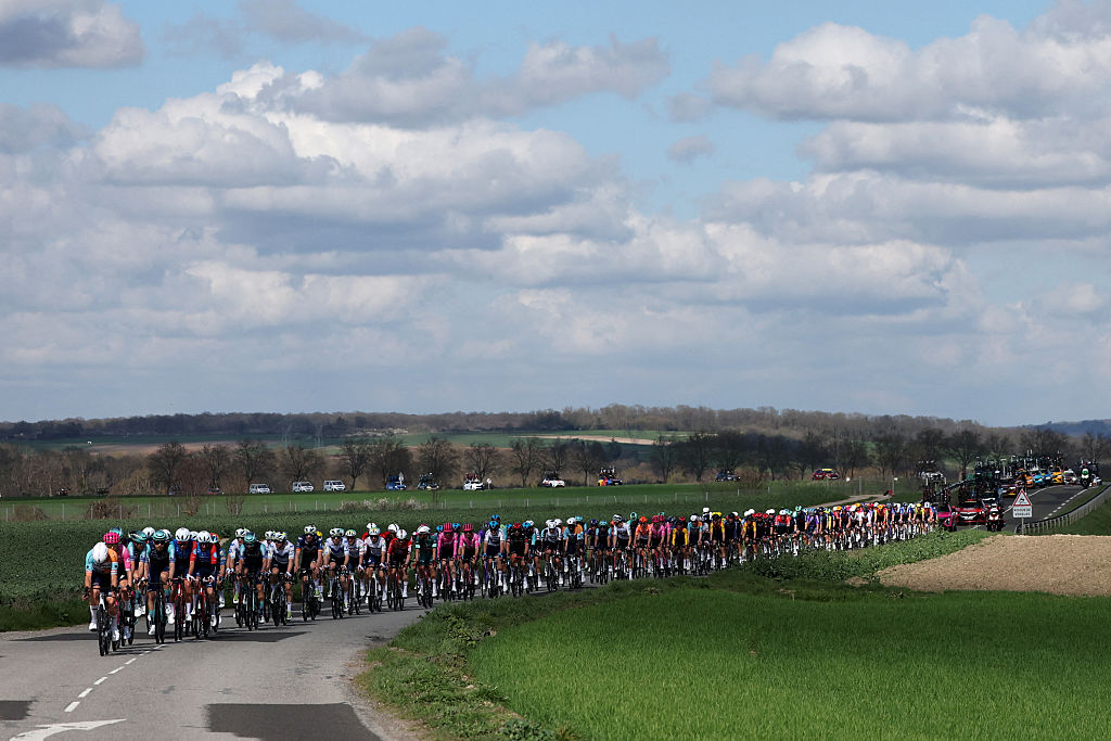 The pack rides during the 2nd stage of the Paris-Nice cycling race, 187 km between &Eacute;p&ocirc;ne and Montargis, on March 9, 2026. (Photo by Anne-Christine POUJOULAT / AFP)