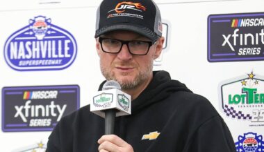An image of NASCAR legend Dale Earnhardt Jr. addressing the media in a press conference
