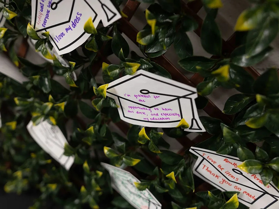 Notes from grads adorn a wall during weekend one of the GRADitude Project in Calgary on Sunday, March 15, 2026. Organized by the Trellis Society, the program outfits Grade 12 students with graduation attire regardless of financial circumstances.