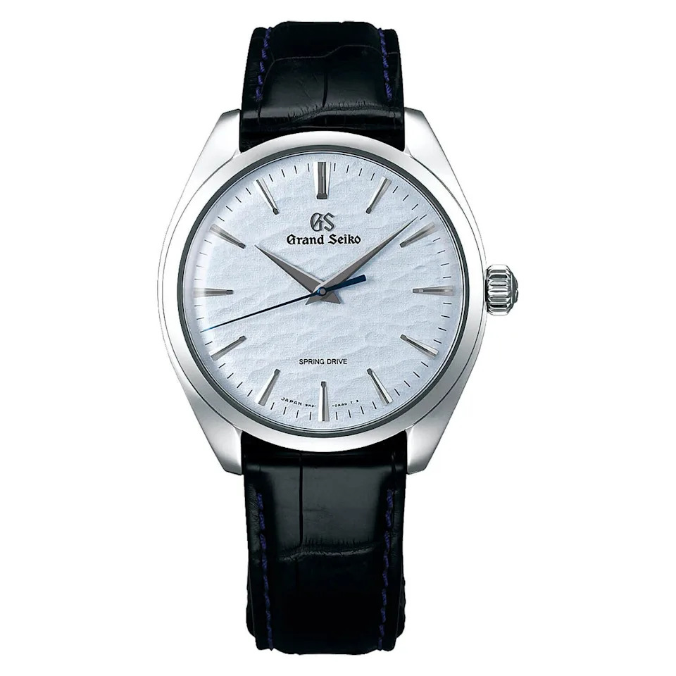 luxury grand seiko wrist watch with a silver dial and black leather strap