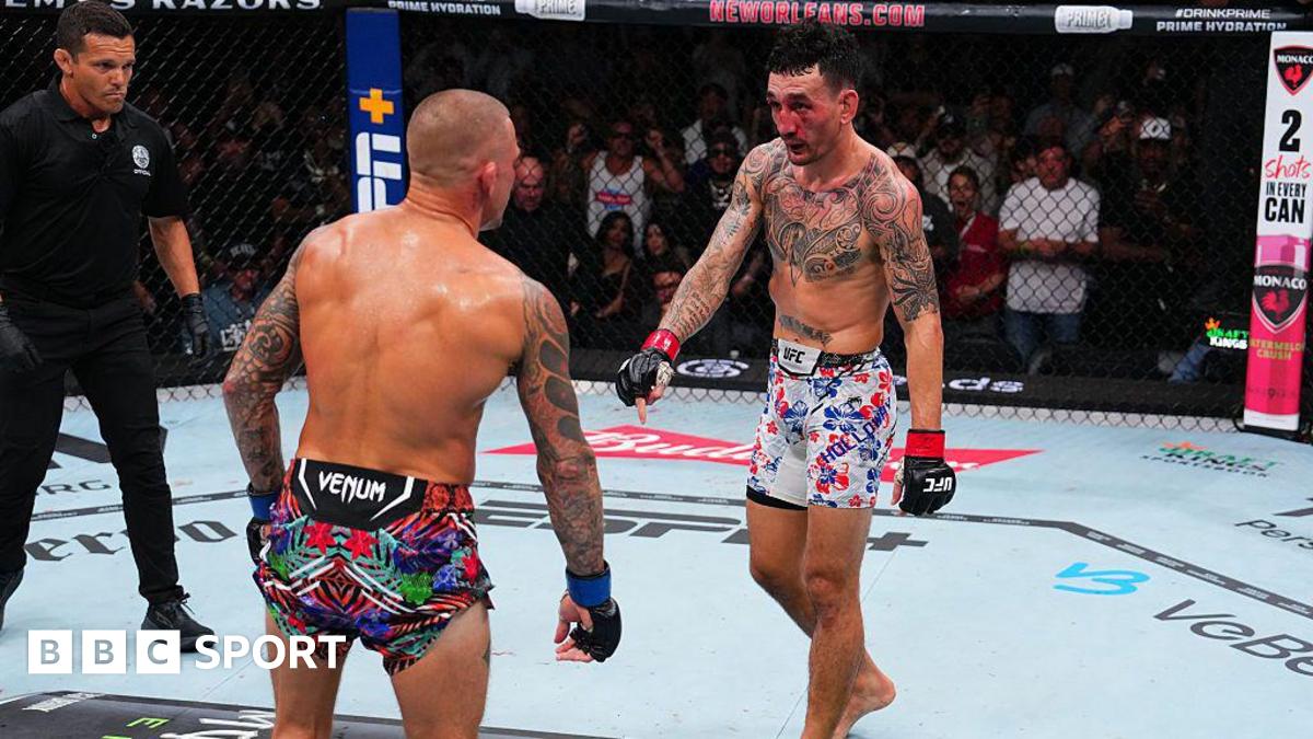 Max Holloway points down towards the end of his fight with Dustin Poirier in 2025