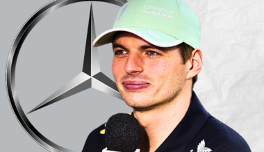Max Verstappen looking happily at a Mercedes logo