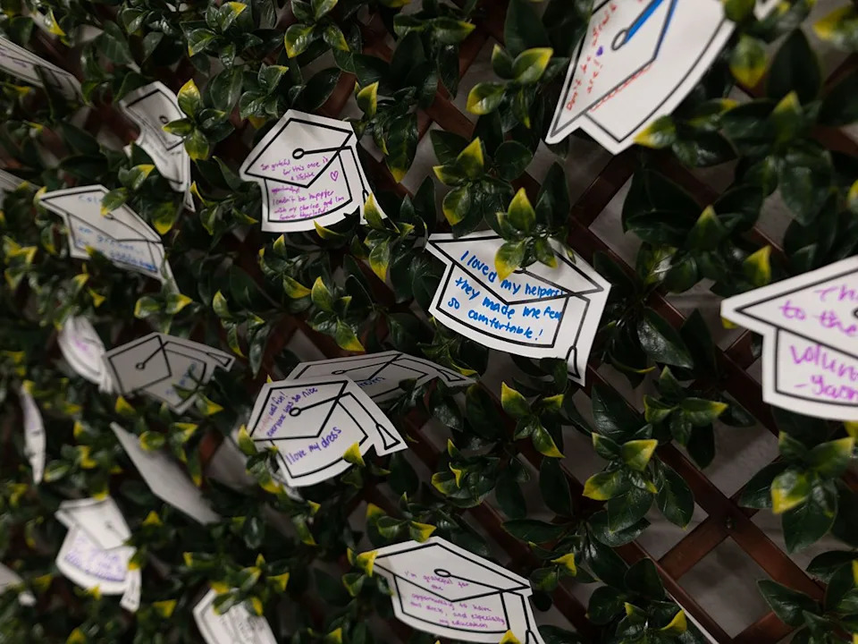 Notes from grads adorn a wall during weekend one of the GRADitude Project in Calgary on Sunday, March 15, 2026. Organized by the Trellis Society, the program outfits Grade 12 students with graduation attire regardless of financial circumstances.
