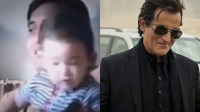 An old video shows Vinod Khanna with baby Akshaye Khanna jostling around.