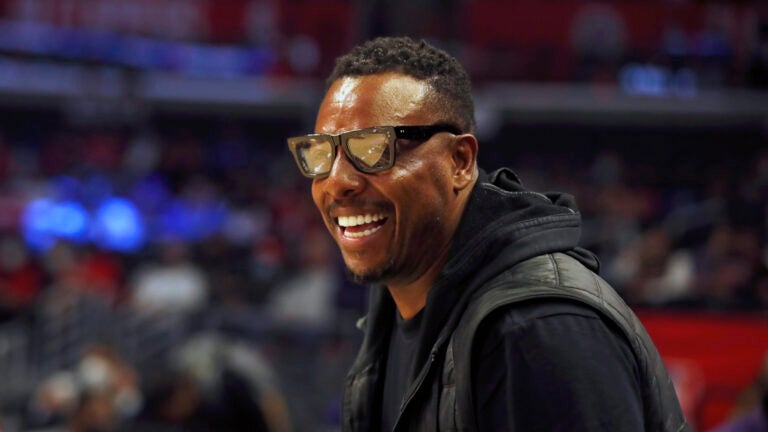 Former NBA basketball player Paul Pierce smiles watching warmups before an NBA basketball game between the Los Angeles Clippers and the Chicago Bulls, Nov. 14, 2021, in Los Angeles.
