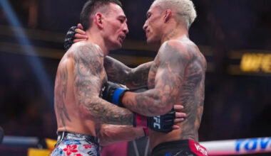 Charles Oliveira and Max Holloway embrace at UFC 326