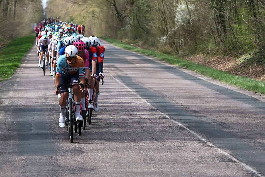 The pack rides during the 2nd stage of the Paris-Nice cycling race, 187 km between &Eacute;p&ocirc;ne and Montargis, on March 9, 2026. (Photo by Anne-Christine POUJOULAT / AFP)