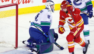 Flames ignite their offence, burn Canucks