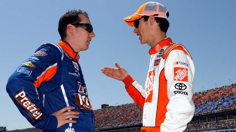 Kyle Busch and Joey Logano speaking on pit road at Las Vegas Motor Speedway NASCAR race