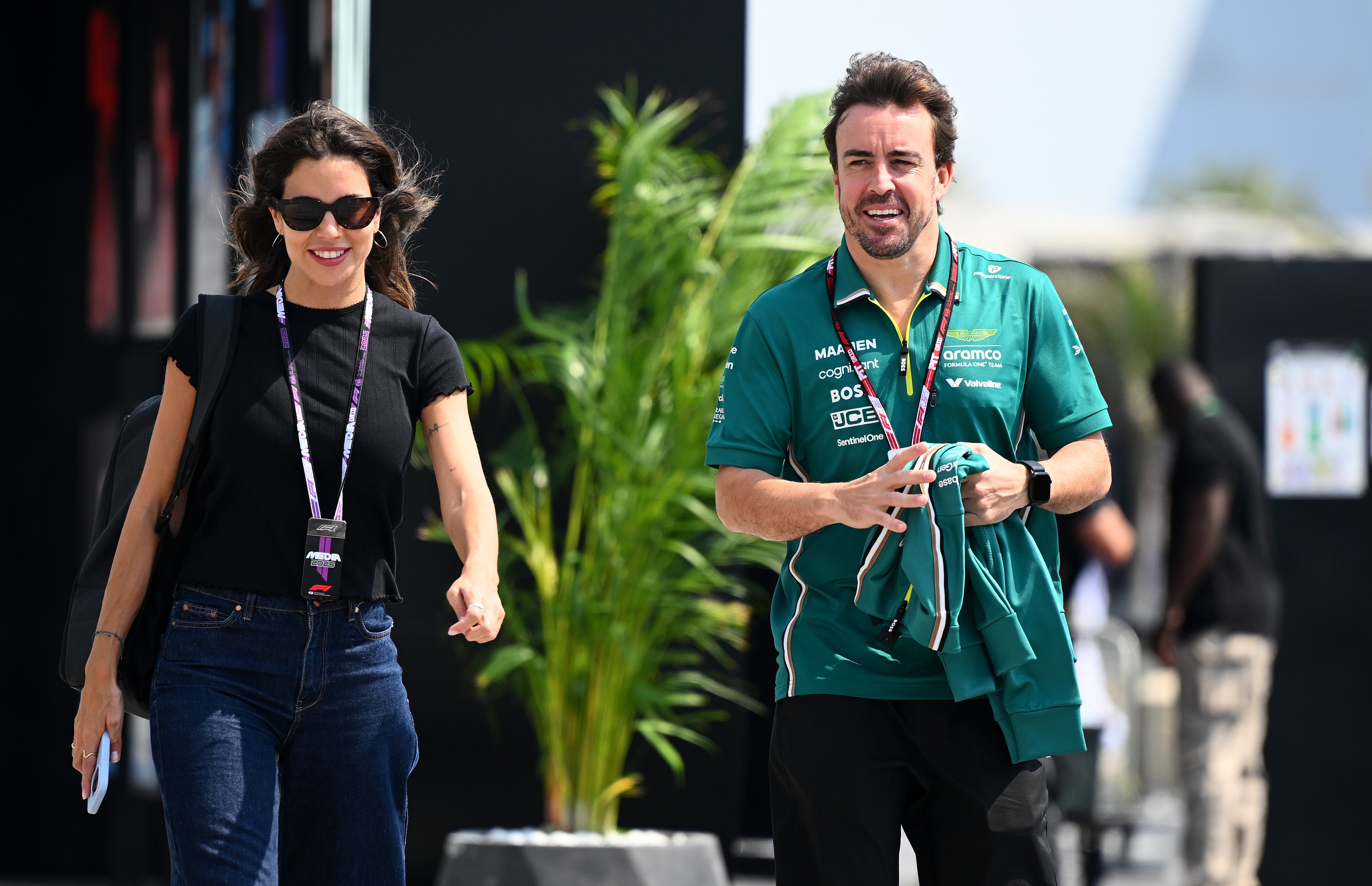 Fernando Alonso will miss media day in Japan after the birth of his first child with partner Melissa Jimenez (left)