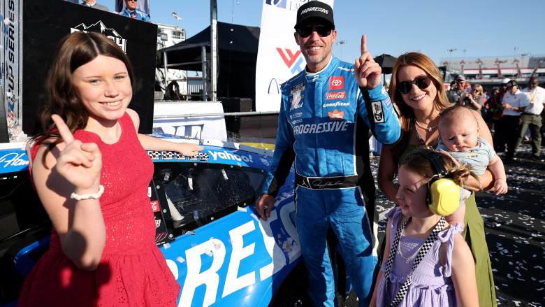 Denny Hamlin celebrates a NASCAR win with fiancée Jordan Fish and their children in Victory Lane