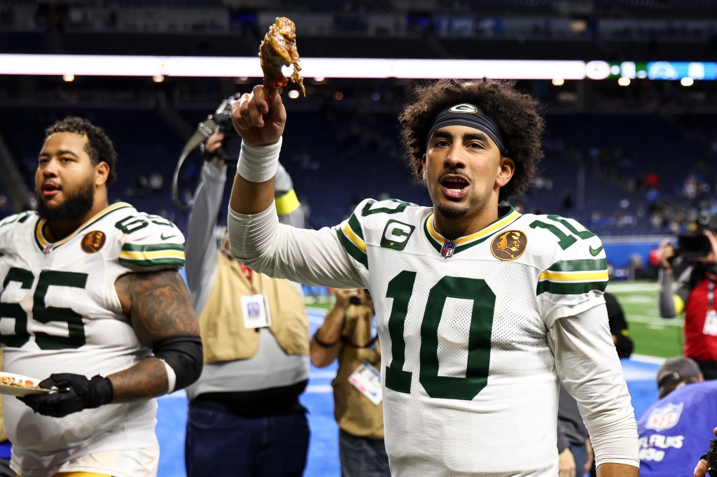 Packers quarterback Jordan Love (10) celebrates his team's Thanksgiving win over the Lions with a turkey leg on Nov. 27, 2025.