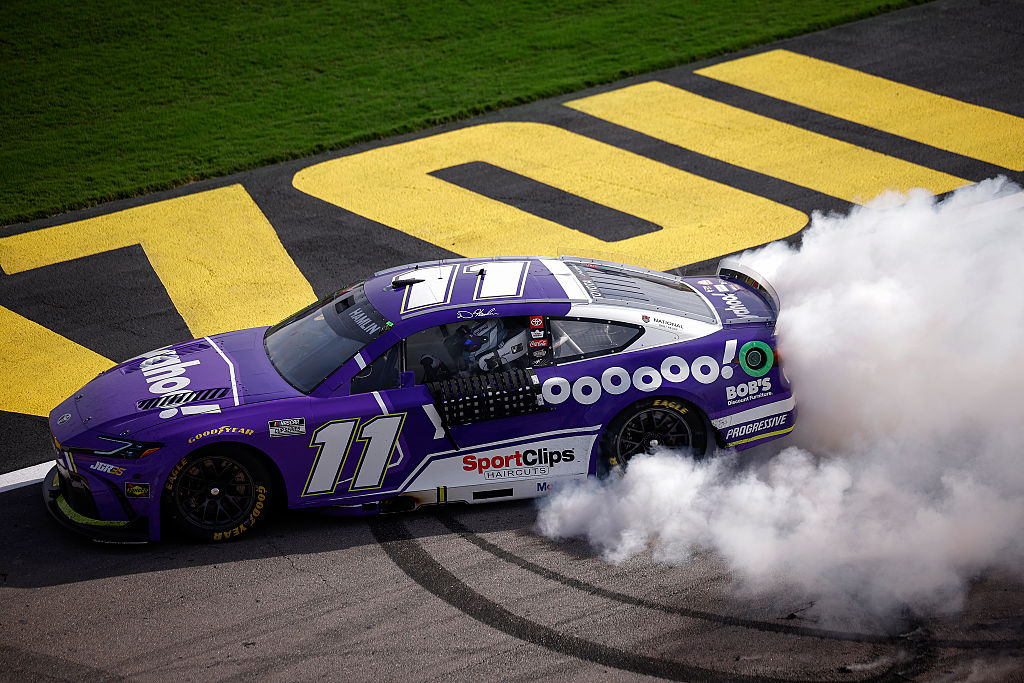 LAS VEGAS, NEVADA - MARCH 15: Denny Hamlin, driver of the #11 Yahoo! Toyota, celebrates with a burnout after winning the NASCAR Cup Series Pennzoil 400 presented by Jiffy Lube at Las Vegas Motor Speedway on March 15, 2026 in Las Vegas, Nevada.