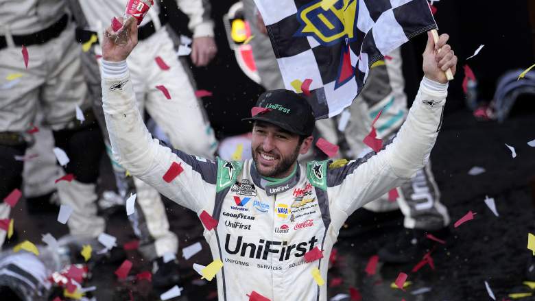 Chase Elliott celebrates with checkered flag after winning at Martinsville Speedway