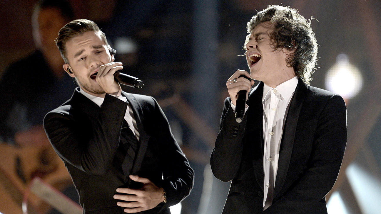 Liam Payne (L) and Harry Styles of One Direction perform onstage during the 2013 American Music Awards at Nokia Theatre L.A. Live on November 24, 2013 in Los Angeles, California.