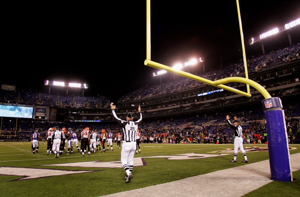 Officials signal a extra point as the Cincinnati Bengals face the Baltimore Ravens at M&T Bank Staduim on November 11, 2007 in Baltimore, Maryland.
