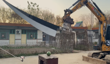 YouTuber Resolves Fraternal Disagreement With Excavator and Hilariously Large Sword