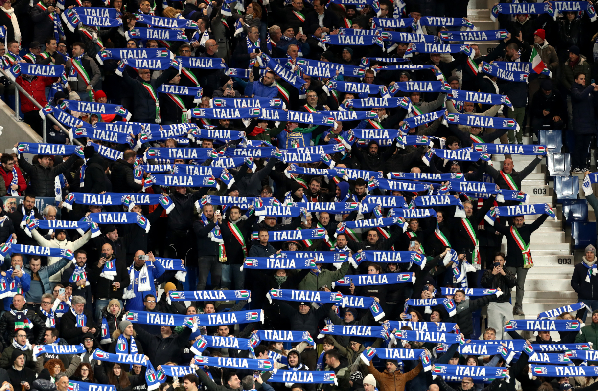 BERGAMO, ITALY - MARCH 26: Fans of Italy show their support by holding up scarves in the stands prior to the FIFA World Cup 2026 European Qualifiers KO play-offs match between Italy and Northern Ireland at Stadio di Bergamo on March 26, 2026 in Bergamo, Italy. (Photo by Marco Luzzani/Getty Images)
