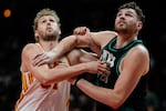 Atlanta Hawks center Jock Landale (31) and Portland Trail Blazers center Donovan Clingan (23) vie for a rebound during the first half of an NBA basketball game, Sunday, March 1, 2026, in Atlanta.