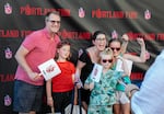 From left, Michael Cady Russell, Mikey Russell (9), Kate Russell, Buddy Russell (6), and Mary Russell (10) pose for a family photo at the launch party for Portland’s new WNBA team the Portland Fire, July 15, 2025. Mary, who currently plays basketball, says she is very excited to have a WNBA team in Portland and hopes she can be on the team one day. 