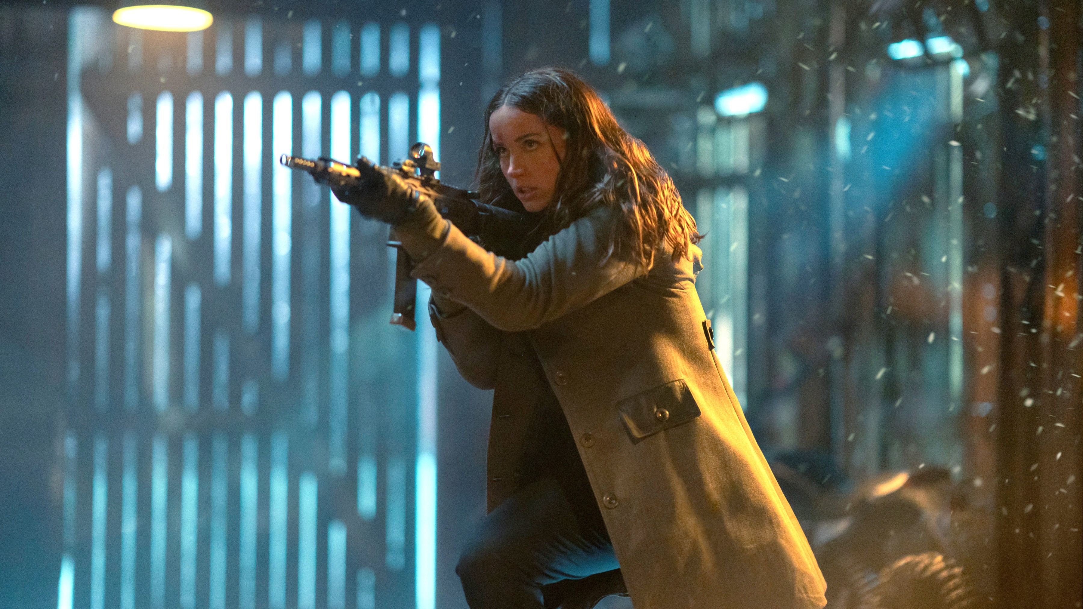 Eve (Ana de Armas) readies an assault rifle in a scene from "Ballerina"