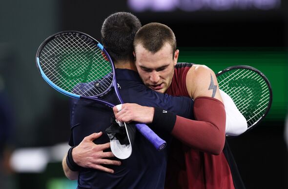 Jack Draper hugs Novak Djokovic