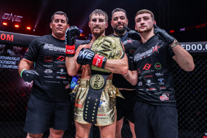 Jonathan Haggerty poses with his team and the ONE Championship belt, returns at ONE Samurai 1