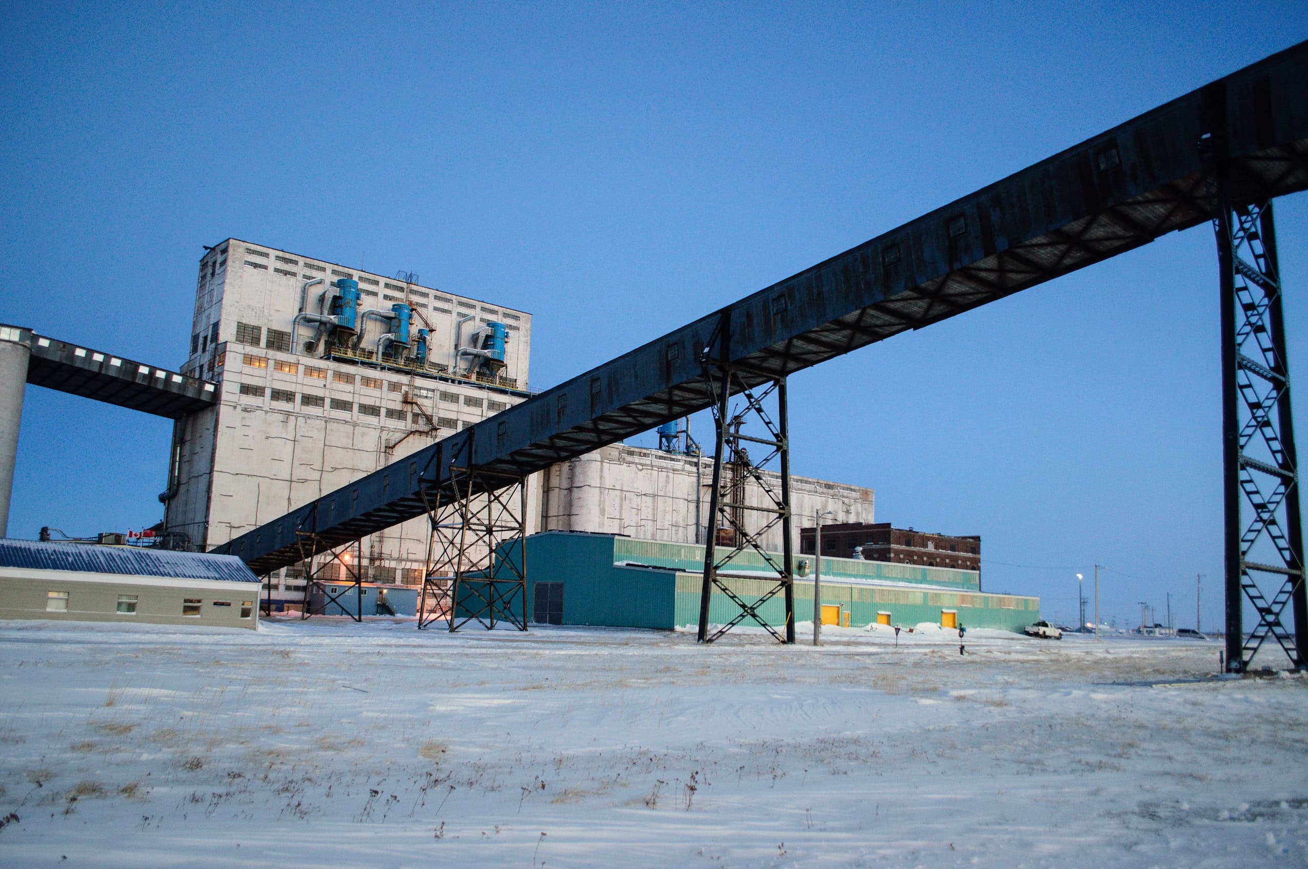 A port building against an icy landscape.
