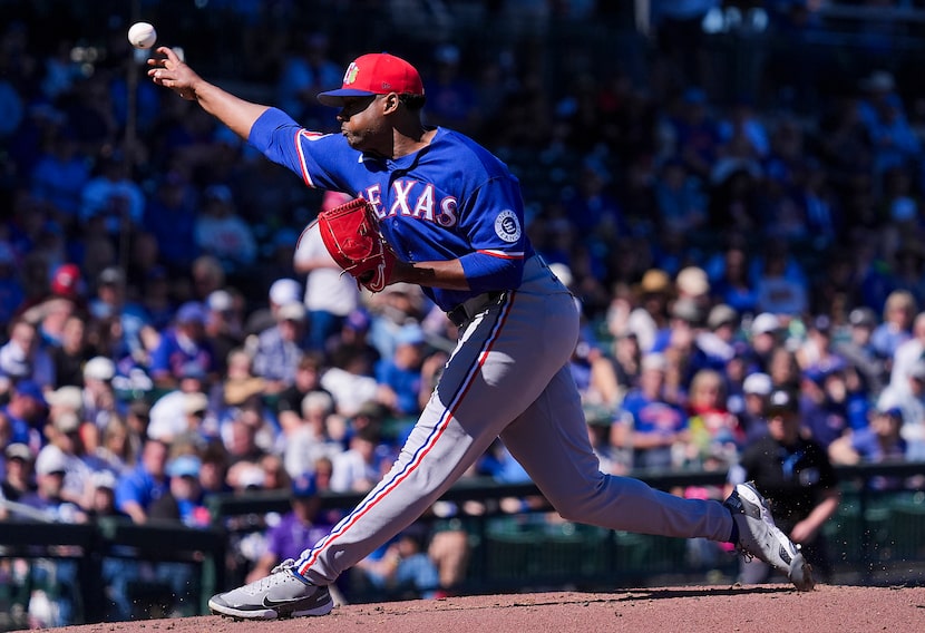 Texas Rangers pitcher Kumar Rocker delivers during the first inning of a spring training...