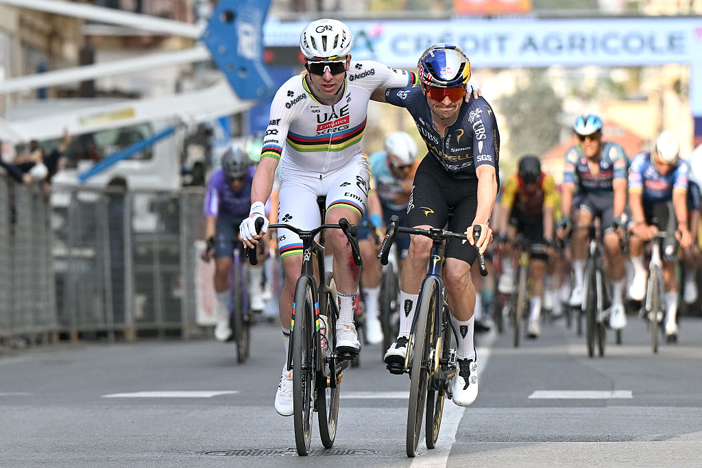 SANREMO, ITALY - MARCH 21: Race winner Tadej Pogacar of Slovenia and UAE Team Emirates - XRG and the second place winner, Thomas Pidcock of Great Britain and Team Pinarello Q36.5 Pro Cycling react after the 117th Milano-Sanremo 2026, Men&amp;apos;s Elite a 298km one day race from Pavia to Sanremo / #UCIWT / on March 21, 2026 in Sanremo, Italy. (Photo by Dario Belingheri/Getty Images)