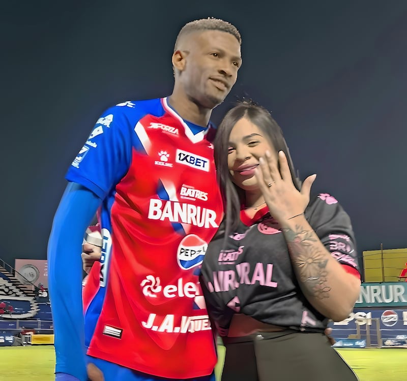 Derrickson Quiros and his then fiancee after he proposed on the pitch
