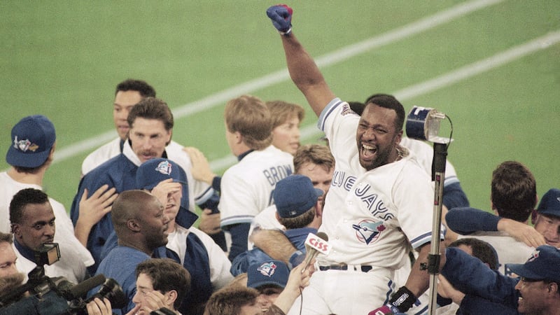 Toronto Blue Jays right fielder Joe Carter gets a victory ride on teammates' shoulders after his game-winning homerun to beat the Philadelphia Phillies 6-4 and clinch the Jays second consecutive World Series championship Saturday, Oct. 24, 1993 in Toronto. (AP Photo/Elise Amendola)