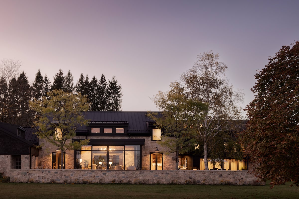 An old farm’s outbuildings embraced in a modern home