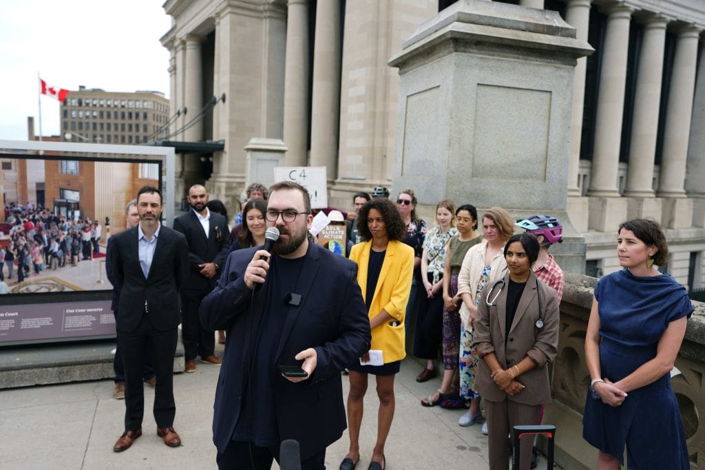 Louis Couillard, climate campaigner at Greenpeace Canada, speaks outside the sentate in Ottawa.