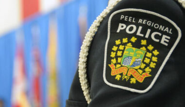 An emergency vehicle and police presence at an accident scene on Hurontario Street in Mississauga