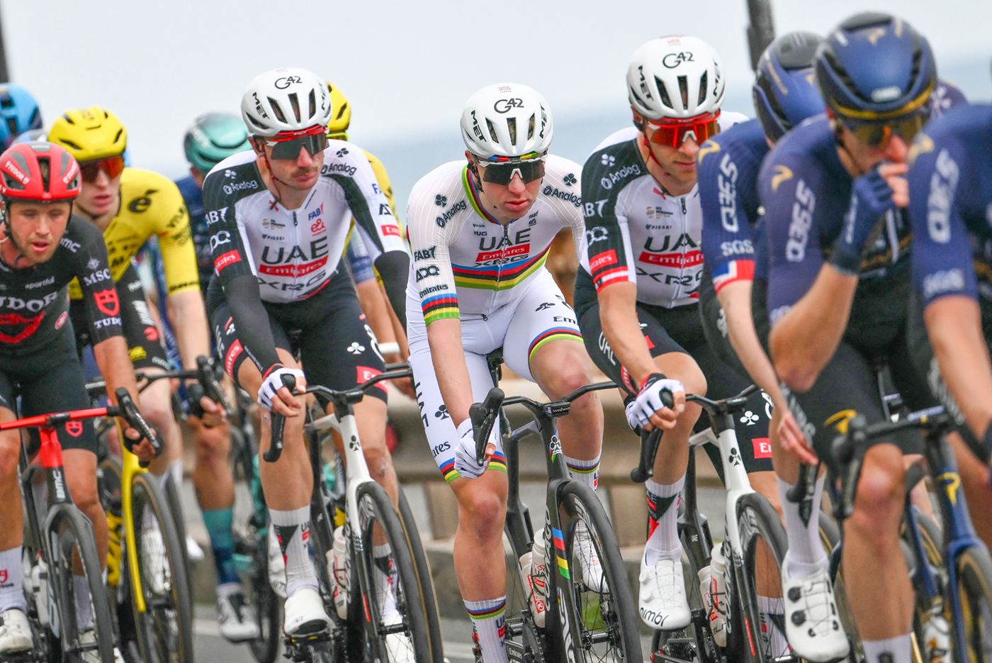 UAE Team Emirate's Slovenian rider Tadej Pogacar (C) rides in the pack during the 117th Milan - Sanremo one-day classic cycling race, on March 21, 2026. (Photo by Marco BERTORELLO / AFP via Getty Images)
