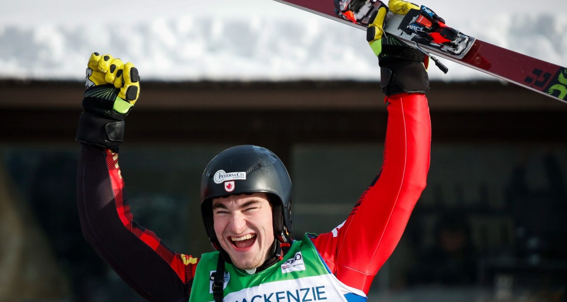 A member of Team Canada celebrates with his hands in the air after completing a World Cup run
