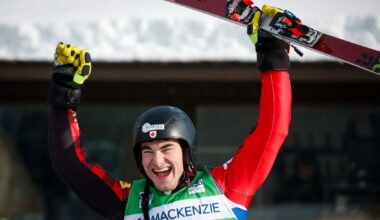 A member of Team Canada celebrates with his hands in the air after completing a World Cup run