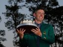 Winner Rory McIlroy, of Northern Ireland, holds the trophy at the Masters golf tournament, Sunday, April 13, 2025, in Augusta, Ga.