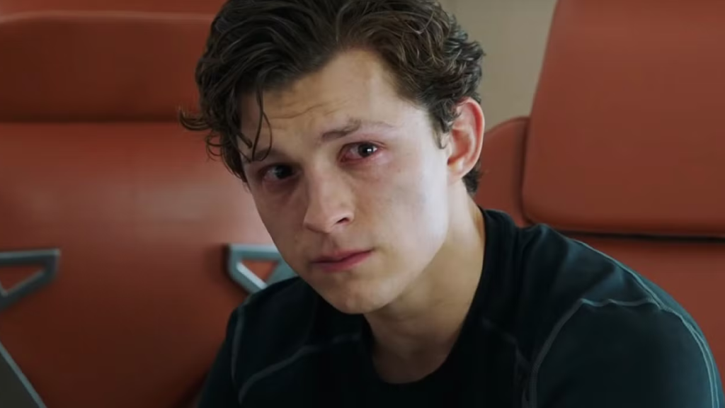 Tom Holland as Peter Parker looking distressed.